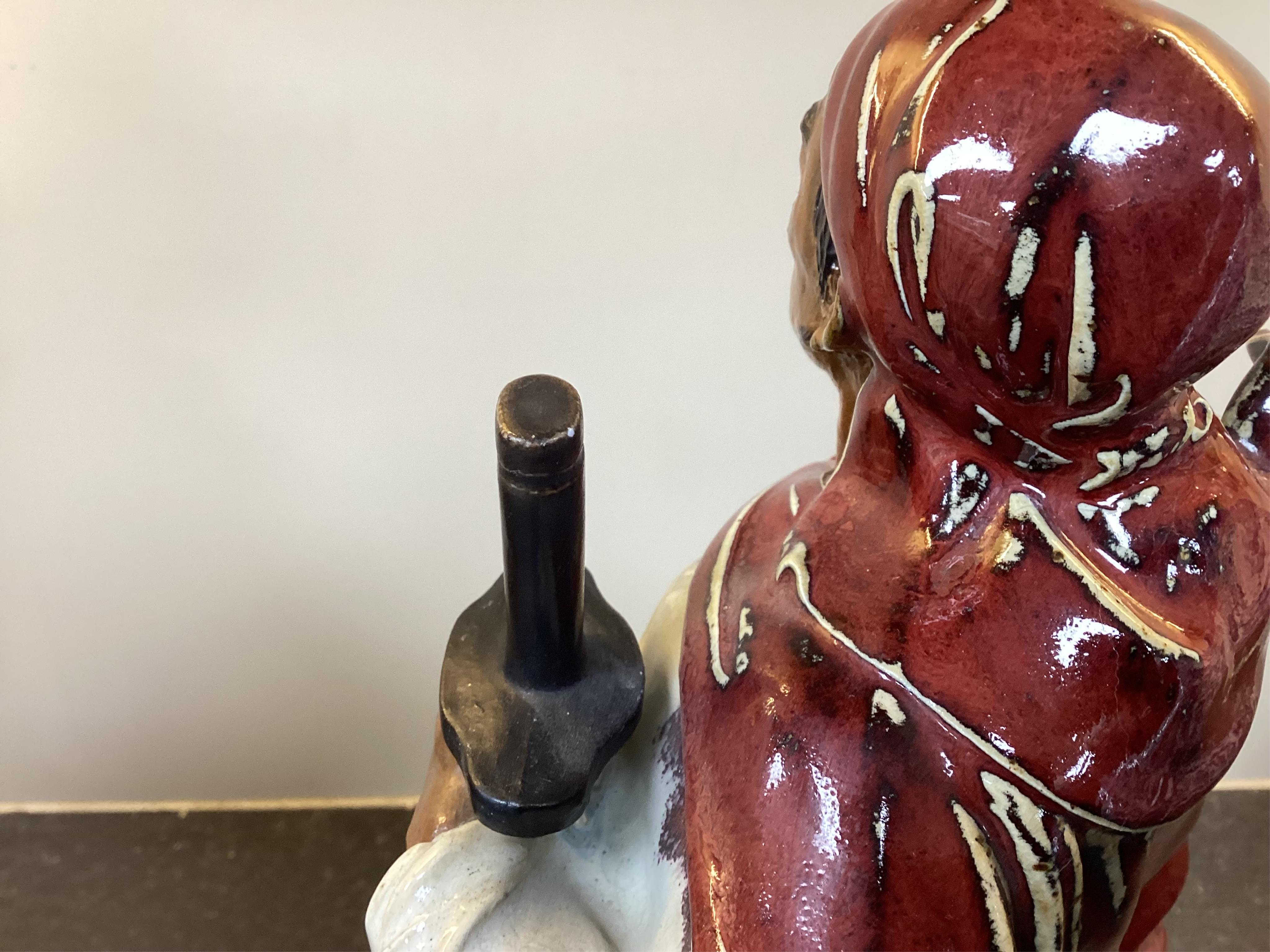 A large Chinese Shiwan stoneware figure of a warrior, 20th century